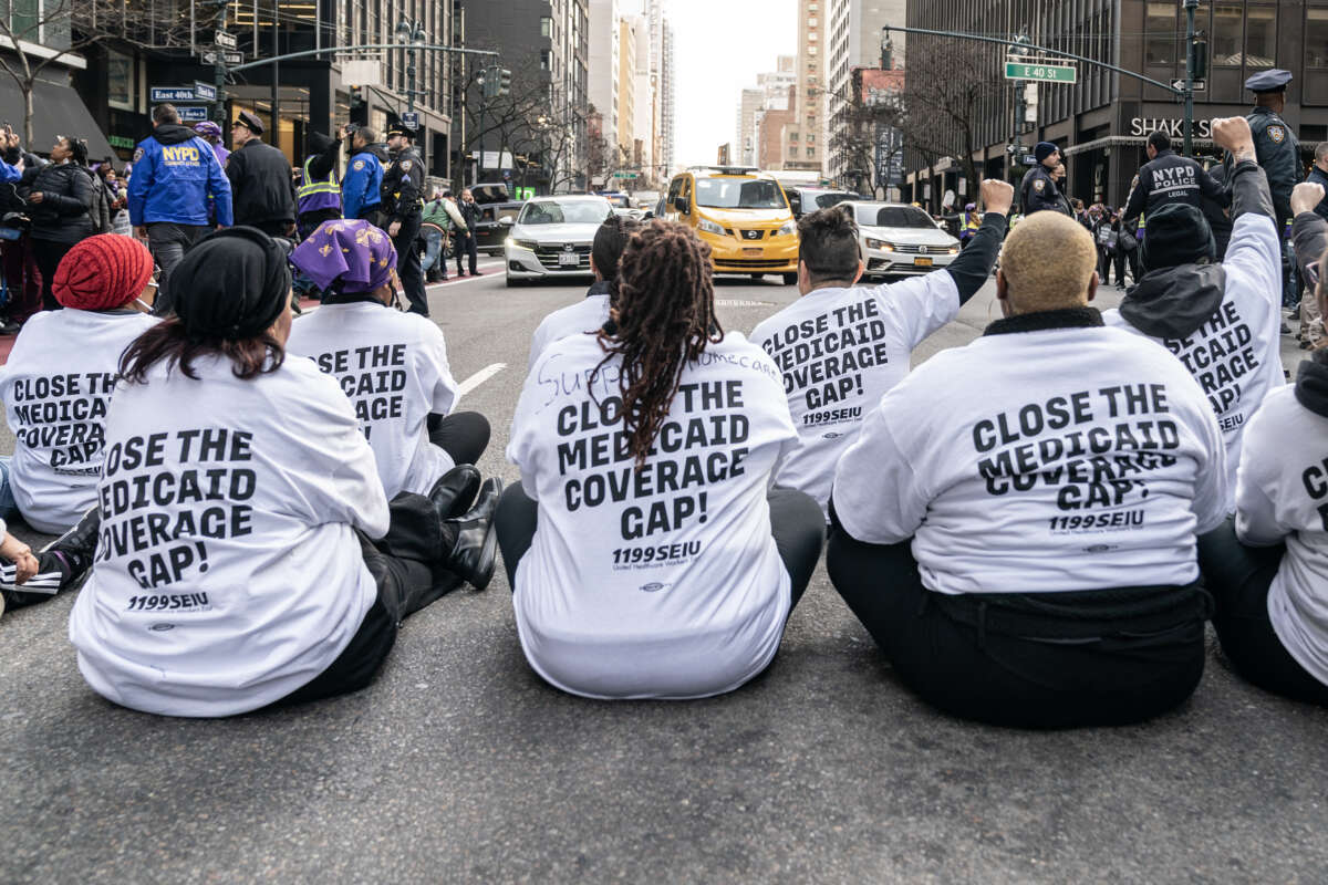 Hundreds of 1199SEIU health care workers staged a rally and sit to block 3rd avenue, where some were arrested, to protest health care cuts in Governor Kathy Hochul's budget on March 29, 2023 in New York City.