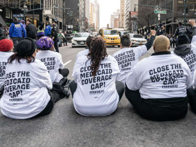Hundreds of 1199SEIU health care workers staged a rally and sit to block 3rd avenue, where some were arrested, to protest health care cuts in Governor Kathy Hochul's budget on March 29, 2023 in New York City.