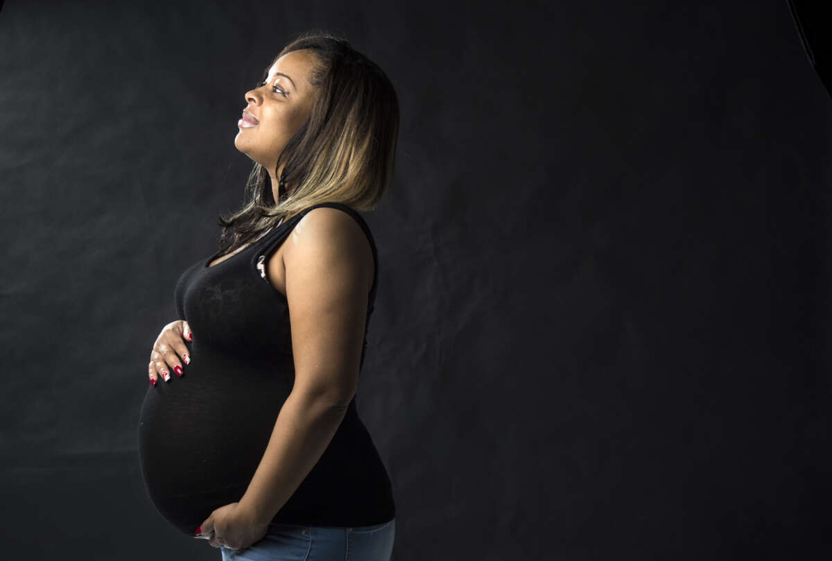 Maya Warren, a pregnant mother who works as an Uber driver with no paid time off for maternity leave, poses for a portrait in Washington, D.C., on Tuesday, November 22, 2016.