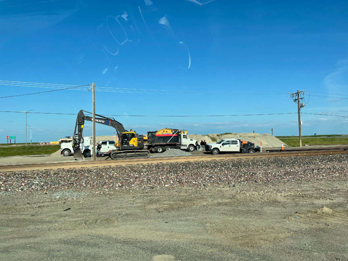 Construction workers attempted to raise the levee on the canal which sits about half a mile east of the prison. 