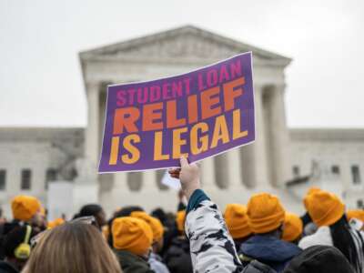 Activists and students protest in front of the Supreme Court during a rally for student debt cancellation in Washington, D.C, on February 28, 2023.