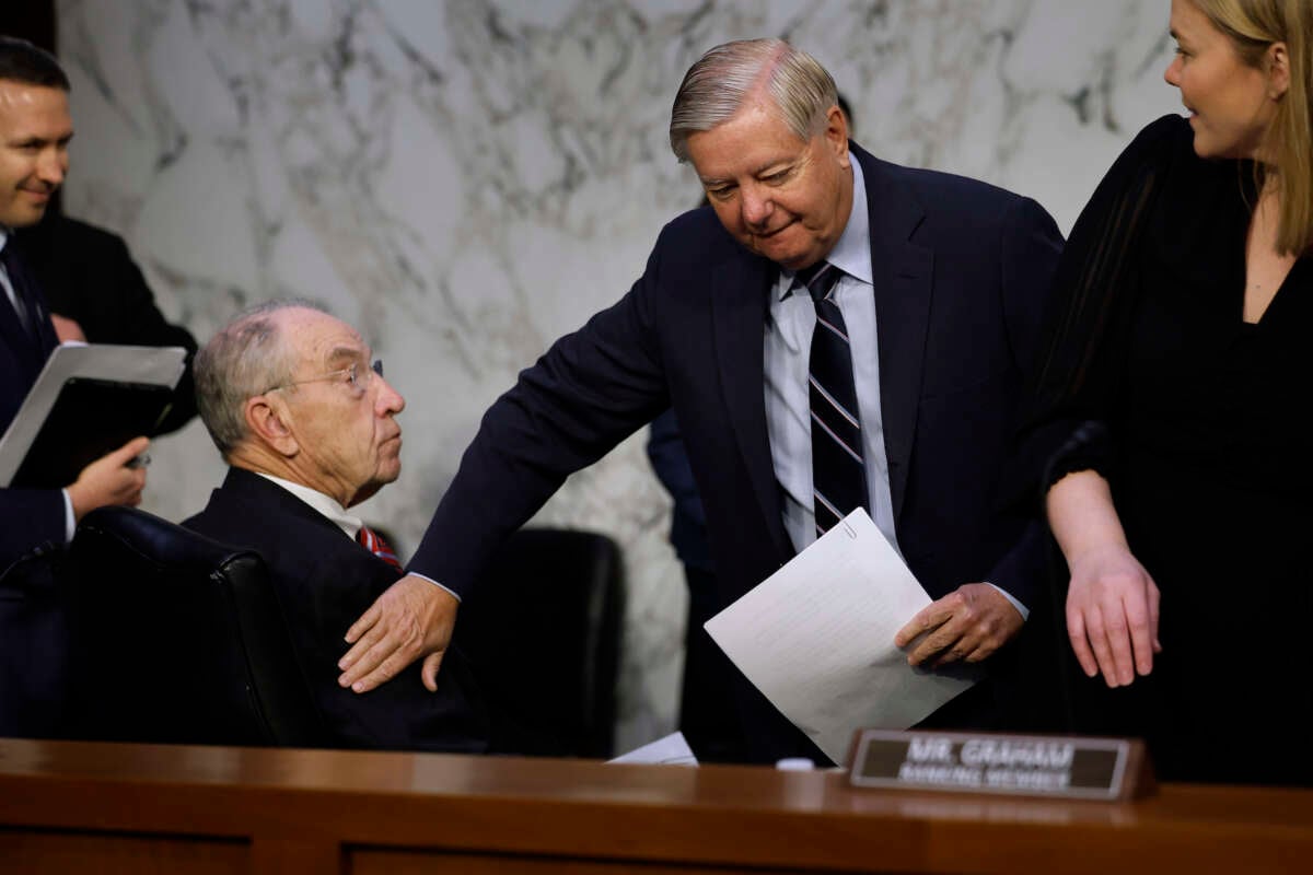 Senate Judiciary Committee ranking member Sen. Lindsey Graham (R-South Carolina) pats Sen. Charles Grassley (R-Iowa) on the shoulder before a hearing on Supreme Court ethics reform on Capitol Hill on May 02, 2023 in Washington, D.C.