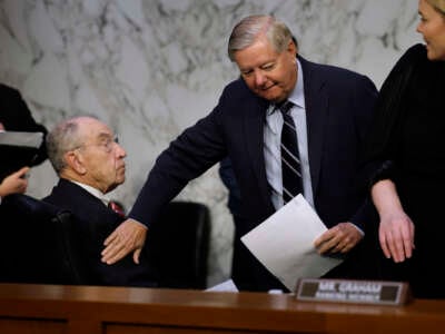 Senate Judiciary Committee ranking member Sen. Lindsey Graham (R-South Carolina) pats Sen. Charles Grassley (R-Iowa) on the shoulder before a hearing on Supreme Court ethics reform on Capitol Hill on May 02, 2023 in Washington, D.C.
