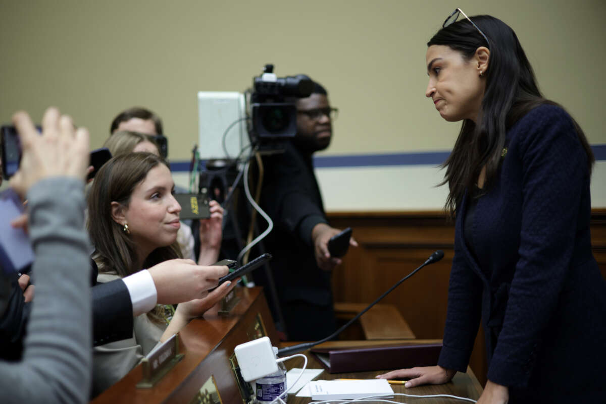 Rep. Alexandria Ocasio-Cortez (R) speaks to members of the press during a break of a hearing before the House Oversight and Accountability Committee at Rayburn House Office Building on Capitol Hill on February 8, 2023 in Washington, D.C.