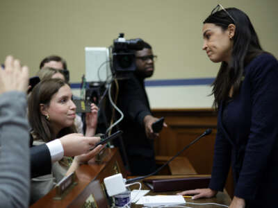 Rep. Alexandria Ocasio-Cortez (R) speaks to members of the press during a break of a hearing before the House Oversight and Accountability Committee at Rayburn House Office Building on Capitol Hill on February 8, 2023 in Washington, D.C.