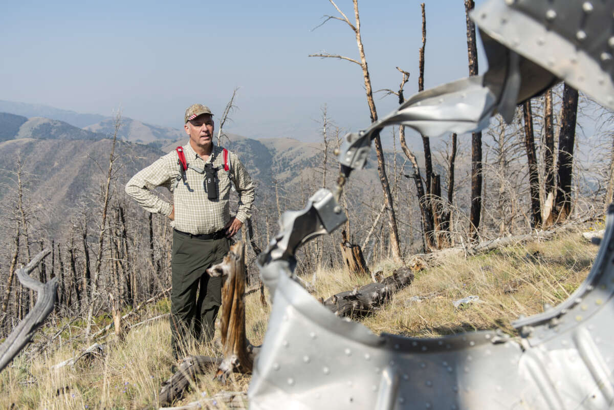 Montana Gov. Greg Gianforte inspects the wreckage of a crash that killed four airmen at 8,500 feet on Emigrant Peak on July 24, 2021 in Emigrant, Montana.