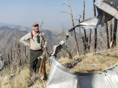 Montana Gov. Greg Gianforte inspects the wreckage of a crash that killed four airmen at 8,500 feet on Emigrant Peak on July 24, 2021 in Emigrant, Montana.