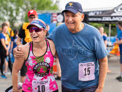 Sens. Kyrsten Sinema, and Joe Manchin congratulate each other after finishing the ACLI Capital Challenge 3-mile race in Anacostia Park in Washington, D.C. on Wednesday, May 17, 2023. Sinema finished as the fastest female member of Congress.