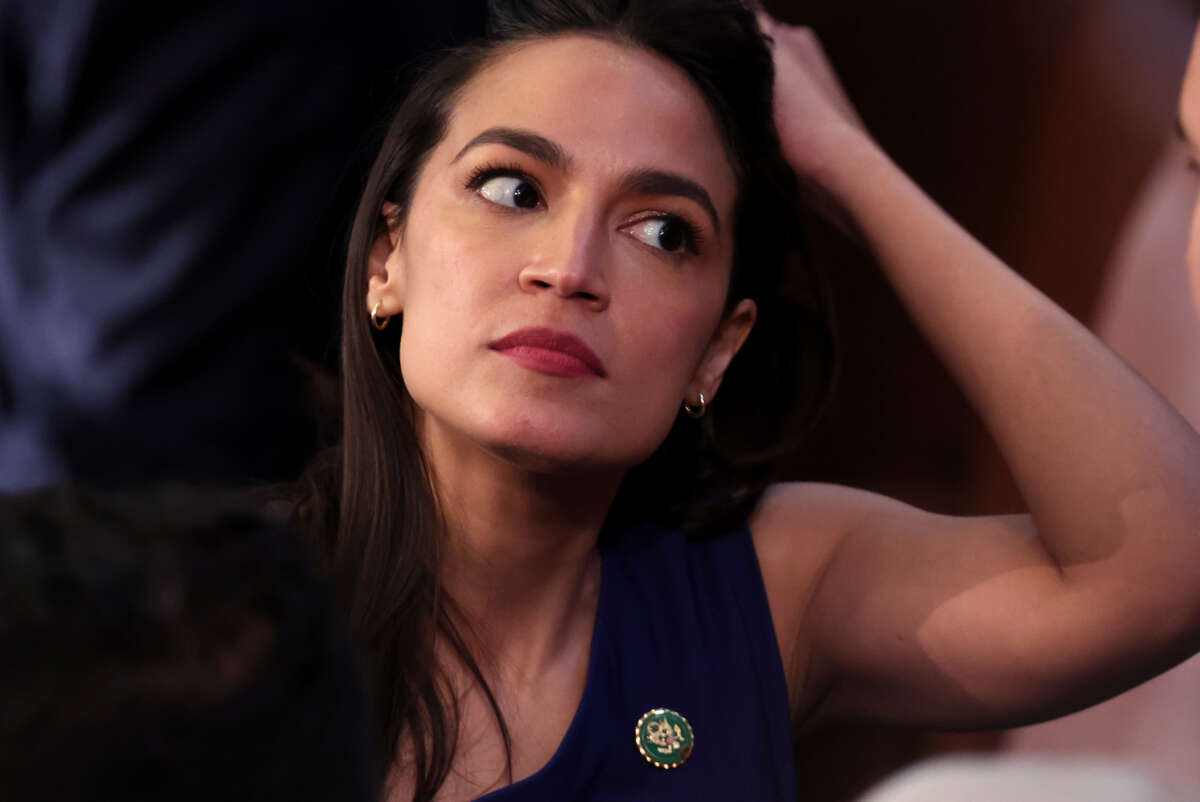 Rep. Alexandria Ocasio-Cortez waits as the House of Representatives holds the election for Speaker of the House on January 03, 2023 in Washington, D.C.