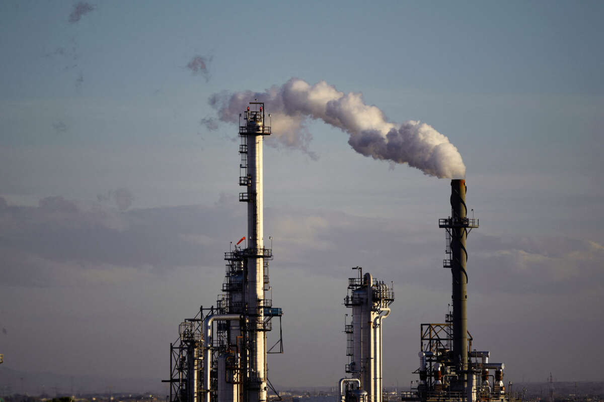 Smokestacks are seen against the sky