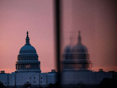 The U.S. Capitol building is seen from the base of the Washington Monument as the sun rises in Washington, D.C., on May 28, 2023.