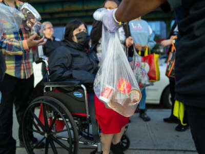 Residents receive food at the St. Helena Pantry in the Bronx on September 28, 2022, in New York City.