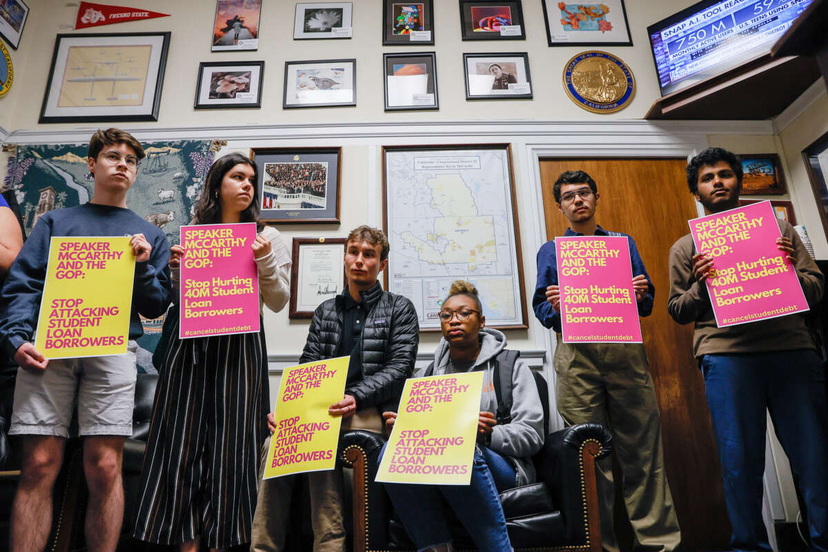 Student loan borrowers stage a sit-in on Capitol Hill at the office of U.S. Speaker of the House Kevin McCarthy to urge him to stop trying to block student debt cancellation on May 9, 2023, in Washington, D.C.