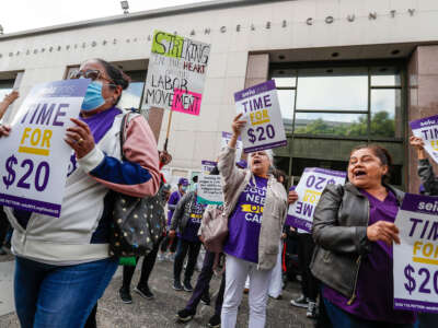 Workers who assist people with disabilities in their homes through the In-Home Supportive Services program urge the Los Angeles County Board of Supervisors to increase their pay on November 1, 2022, in Los Angeles, California.