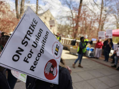 Members of the Indiana Graduate Workers Coalition and their supporters picket outside the chemistry building while striking for union recognition in Bloomington, Indiana, on April 19, 2022.