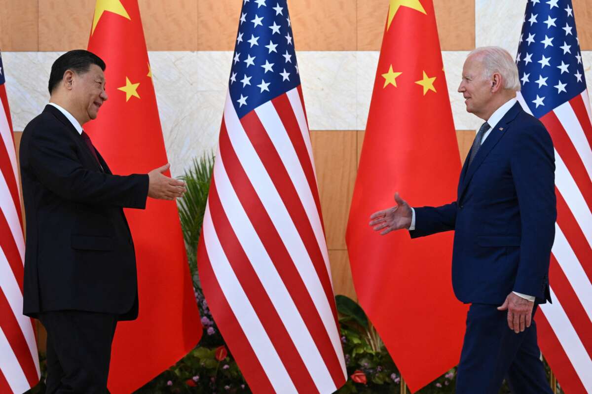 U.S. President Joe Biden (right) and China's President Xi Jinping (left) shake hands as they meet on the sidelines of the G20 Summit in Nusa Dua, Bali, Indonesia, on November 14, 2022.