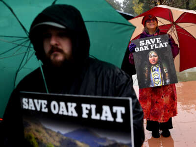 Protestors stand outside the Ninth Circuit Court in Pasadena, California, to challenge a mining deal that would destroy the Oak Flat sacred site in Arizona, on March 21, 2023.