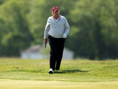 Former President Donald Trump follows his second shot during the pro-am prior to the LIV Golf Invitational - DC at Trump National Golf Club on May 25, 2023, in Sterling, Virginia.
