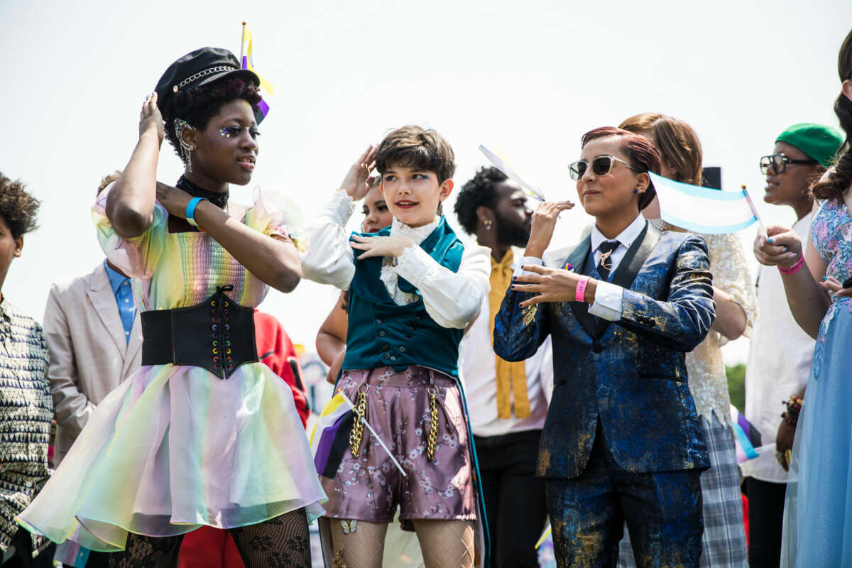 Colorfully-dressed teens dance