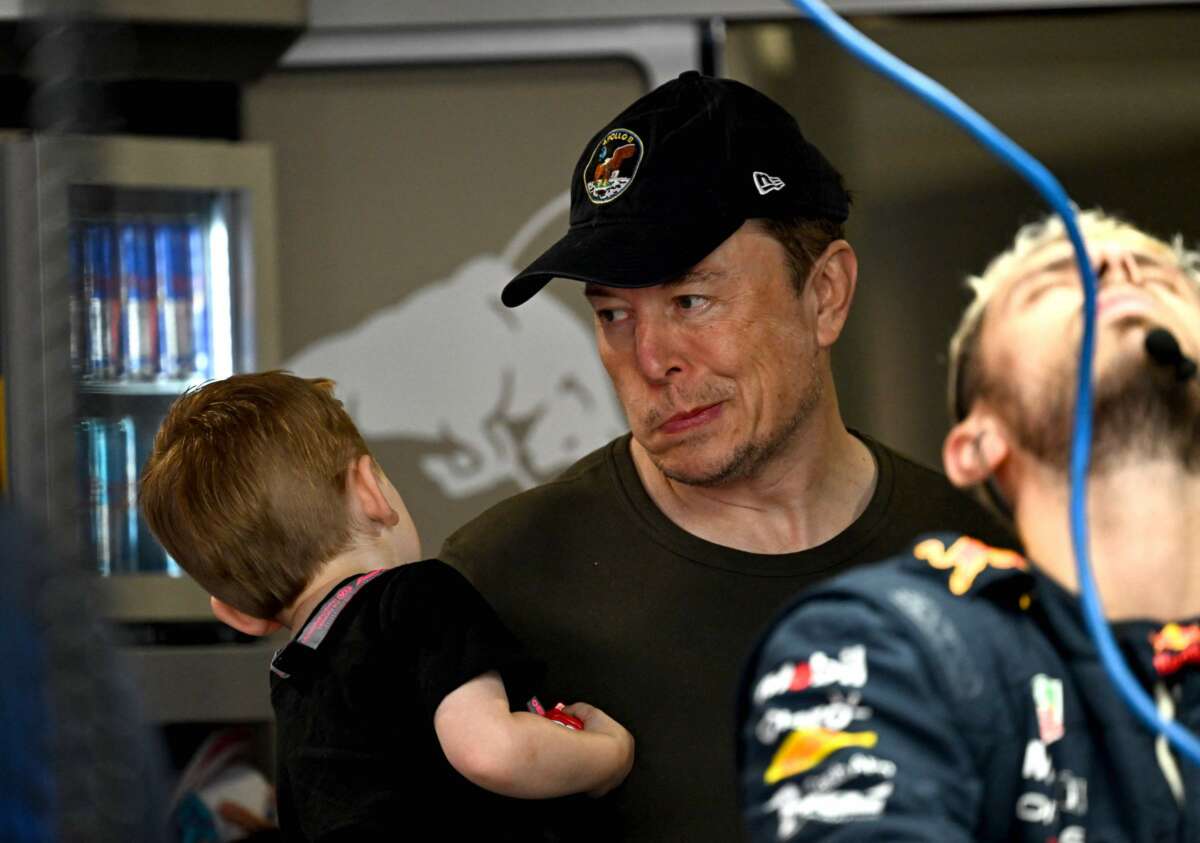 Elon Musk arrives at Red Bull Racing's garage before the 2023 Miami Formula One Grand Prix at the Miami International Autodrome in Miami Gardens, Florida, on May 6, 2023.