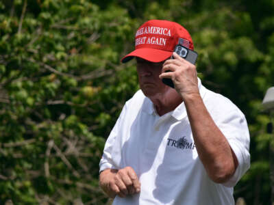 Former President Donald Trump visits the driving range at Trump National Golf Club Washington D.C. in Sterling, Virginia, on May 27, 2023.