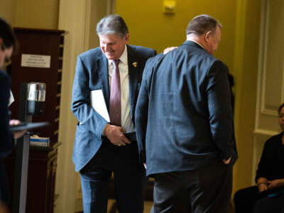 Sen. Joe Manchin (left) and Sen. Jon Tester are seen outside the senate luncheons in the U.S. Capitol on May 2, 2023, in Washington, D.C.