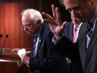 Sen. Bernie Sanders (left) and Sen. Jeff Merkley leave after a news conference on debt limit at the U.S. Capitol on May 18, 2023, in Washington, D.C.