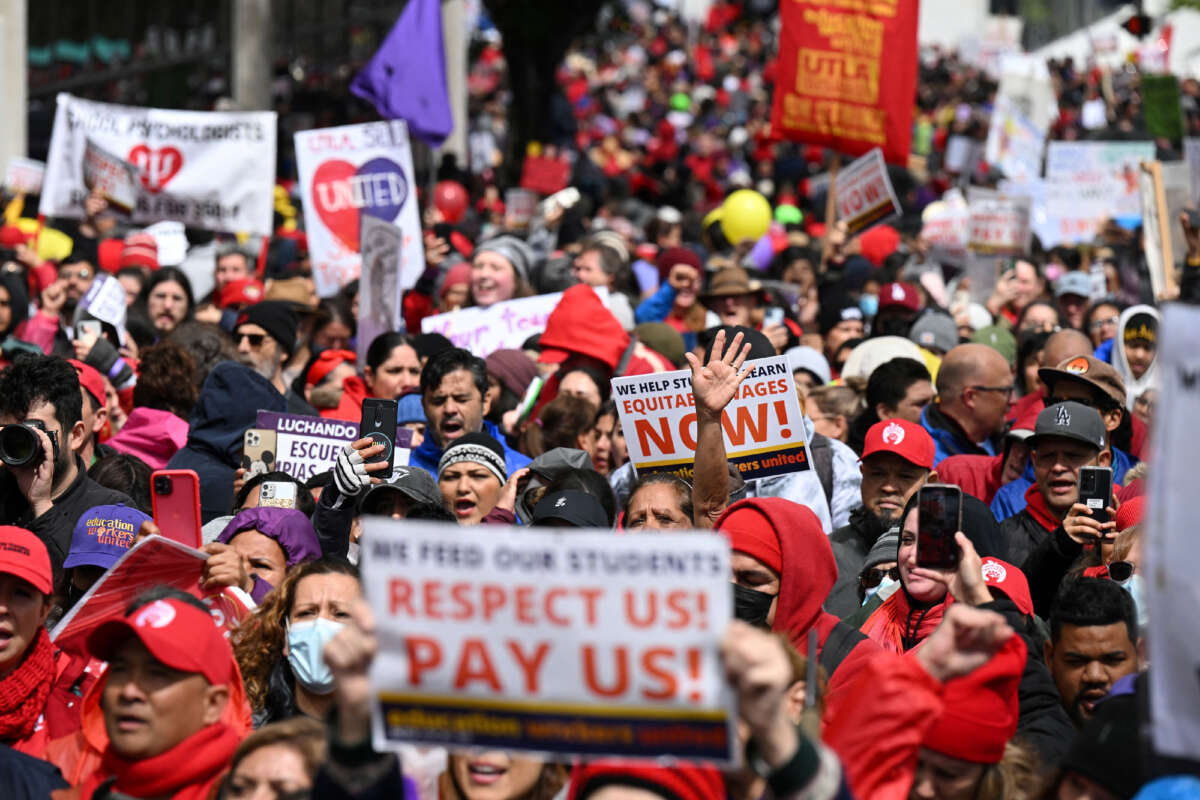 Los Angeles public school support staff, teachers, and supporters rally outside of the school district headquarters on the first day of a three day strike in Los Angeles, California, on March 21, 2023.