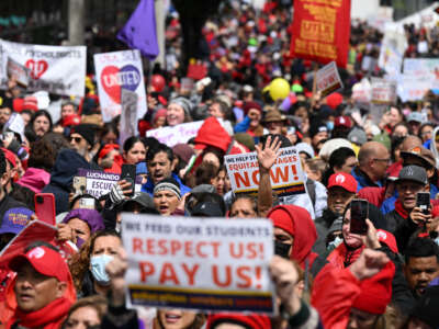 Los Angeles public school support staff, teachers, and supporters rally outside of the school district headquarters on the first day of a three day strike in Los Angeles, California, on March 21, 2023.