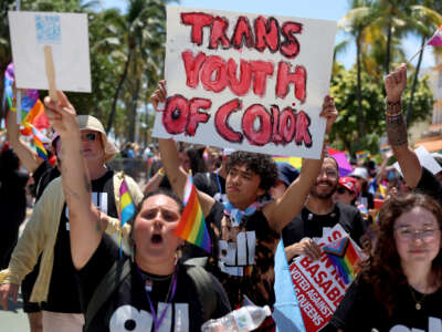 People participate in the 15th annual Miami Beach Pride Celebration parade on April 16, 2023, in Miami Beach, Florida.