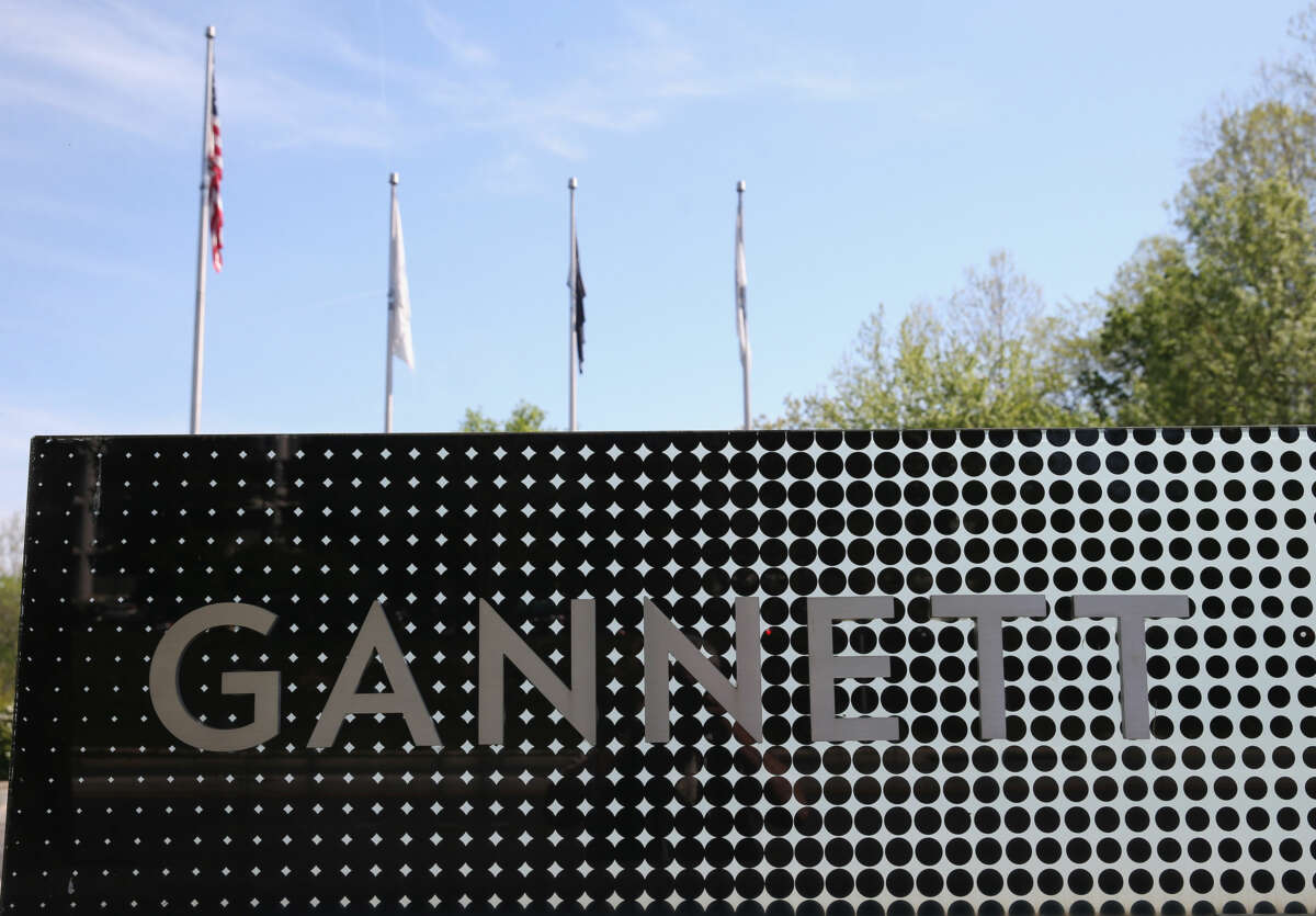 A metal sign reading "GANNETT"