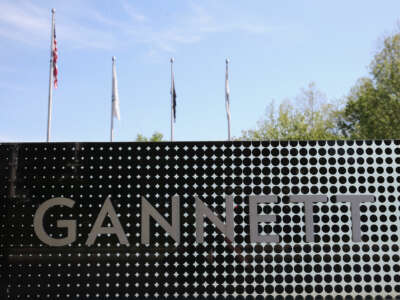 A metal sign reading "GANNETT"