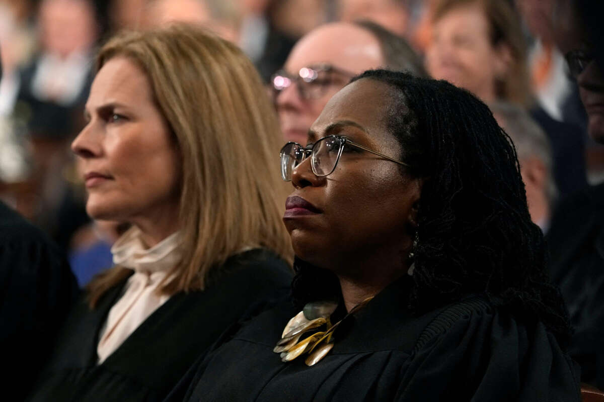 Justice Ketanji Brown Jackson listens to someone speak