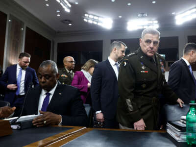 Secretary of Defense Lloyd Austin (left) and Chairman of the Joint Chiefs of Staff General Mark Milley arrive to a hearing with the Senate Armed Services Committee on Capitol Hill on March 28, 2023, in Washington, D.C.