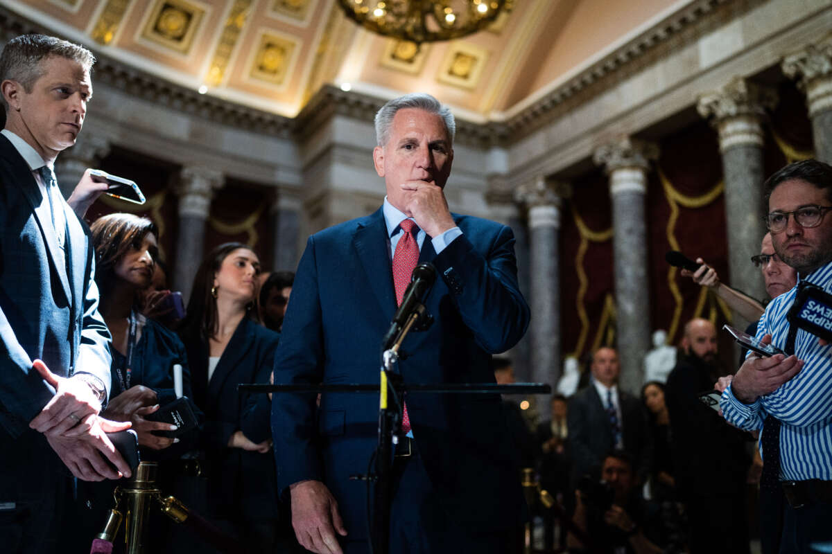 Speaker of the House Kevin McCarthy talks with reporters about the debt ceiling negotiations in the U.S. Capitol's Statuary Hall on May 24, 2023.