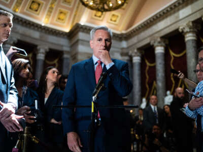 Speaker of the House Kevin McCarthy talks with reporters about the debt ceiling negotiations in the U.S. Capitol's Statuary Hall on May 24, 2023.