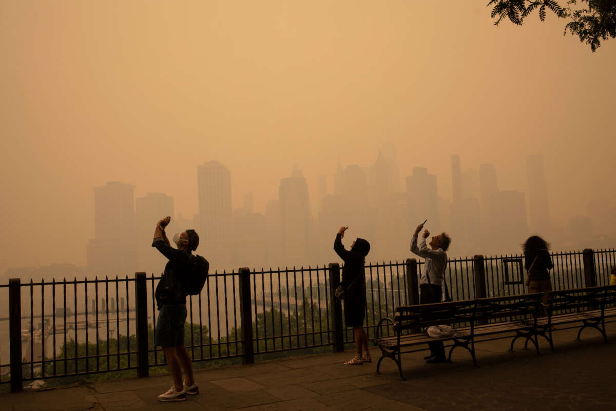 In the middle of the afternoon, smoke from Canadian forest fires blankets the skyline of New York City, June 7, 2023, as seen from Brooklyn, New York.