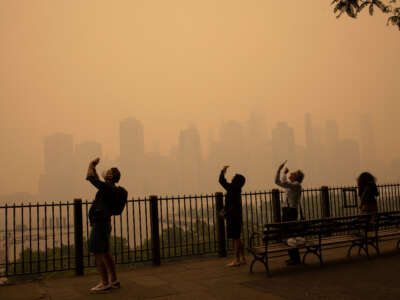 In the middle of the afternoon, smoke from Canadian forest fires blankets the skyline of New York City, June 7, 2023, as seen from Brooklyn, New York.