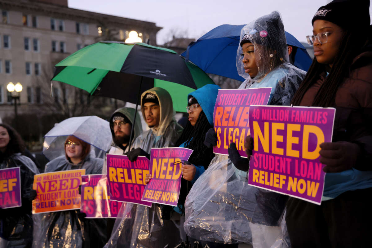 Student loan borrowers gather at Supreme Court the evening before the court hears two cases on student loan relief, to state the relief is legal and needs to happen immediately, on February 27, 2023, in Washington, D.C.