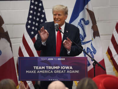 Former President Donald Trump greets supporters at a Team Trump volunteer leadership training event held at the Grimes Community Complex on June 1, 2023, in Grimes, Iowa.