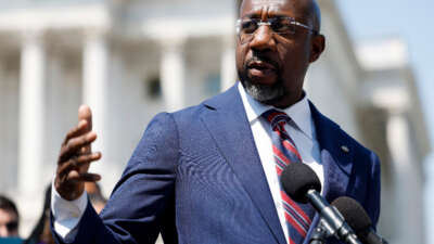 Sen. Raphael Warnock speaks at a press conference on Gun Safety legislation outside the U.S. Capitol Building on May 18, 2023, in Washington, D.C.