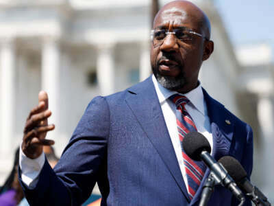 Sen. Raphael Warnock speaks at a press conference on Gun Safety legislation outside the U.S. Capitol Building on May 18, 2023, in Washington, D.C.