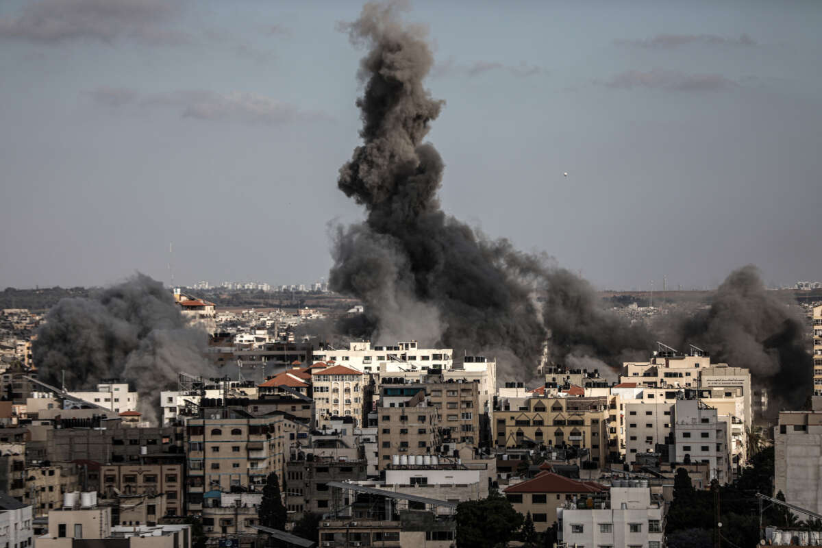 Smoke rises after Israeli warplanes strike headquarters of the Qatari Red Crescent Society in al-Rimal neighborhood of Gaza City, Gaza, on May 17, 2021. According to QRCS, the attack killed two Palestinians, including a child, and injured 10 others.