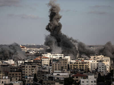 Smoke rises after Israeli warplanes struck the headquarters of the Qatari Red Crescent Society in the al-Rimal neighborhood of Gaza City, Gaza, on May 17, 2021. According to QRCS, the attack killed two Palestinians, including a child, and injured 10 others.
