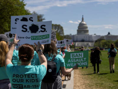 People march to the Capitol to protest for a ban on assault weapons, in Washington, D.C., on April 17, 2023.