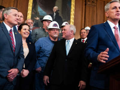 House Majority Leader Steve Scalise, second from right, talks with an energy industry worker as Speaker of the House Kevin McCarthy conducts a news conference after the House passed the Lower Energy Costs Act in the U.S. Capitol on March 30, 2023.