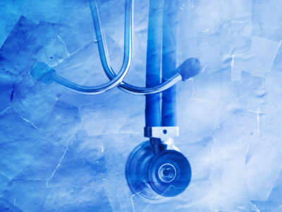 Stethoscope in blue on torn paper