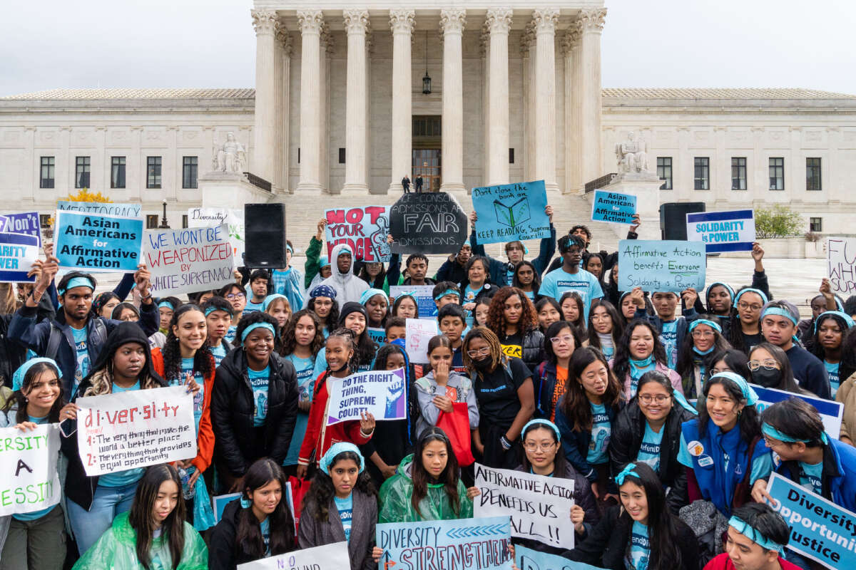 Supporters pose for a group photo during a rally in support affirmative action policies outside the Supreme Court in Washington, D.C. on October 31, 2022.