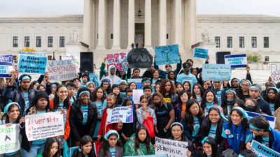 Supporters pose for a group photo during a rally in support affirmative action policies outside the Supreme Court in Washington, D.C. on October 31, 2022.