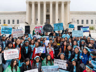 Supporters pose for a group photo during a rally in support affirmative action policies outside the Supreme Court in Washington, D.C. on October 31, 2022.